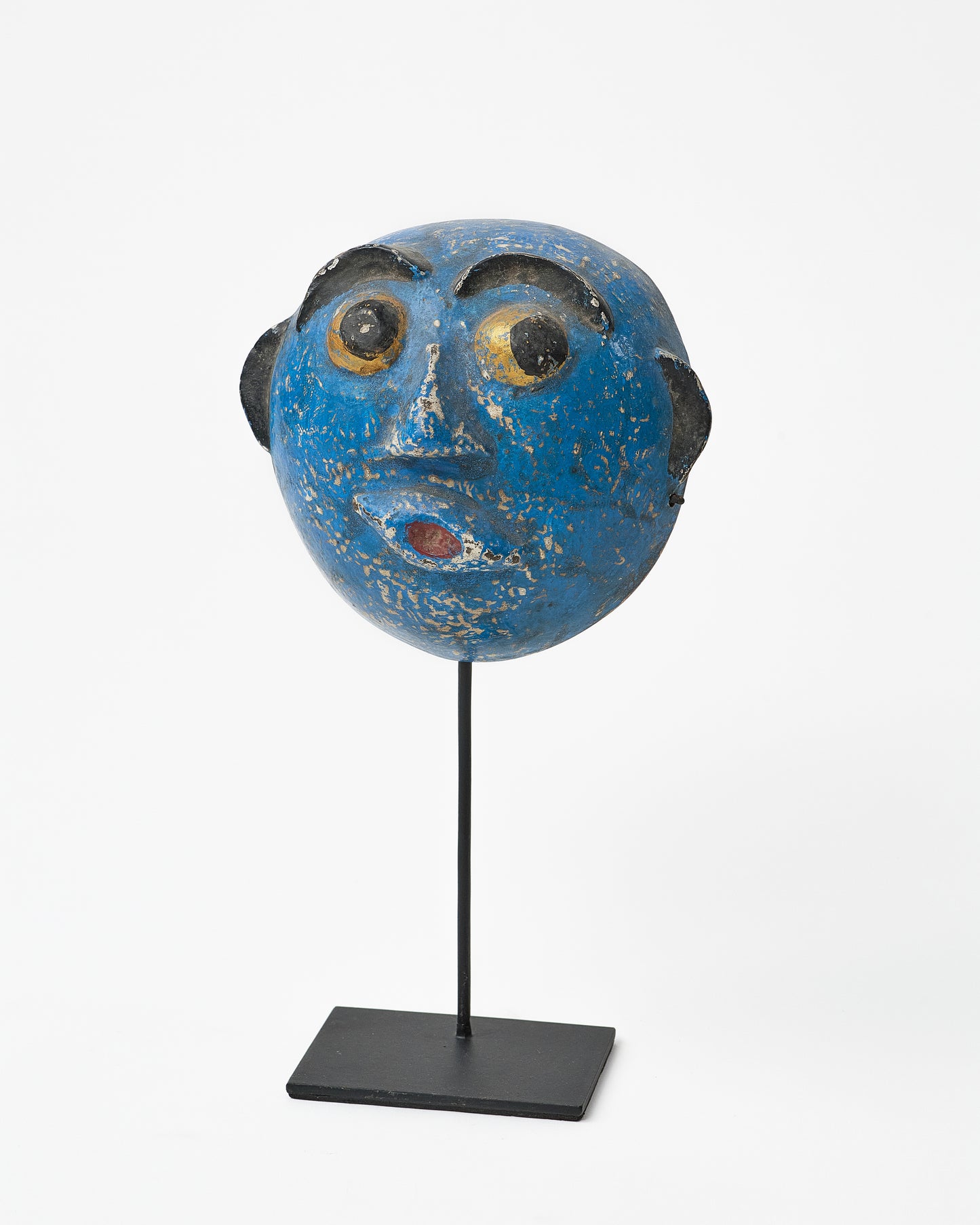 Abstract primitive mask on a stand