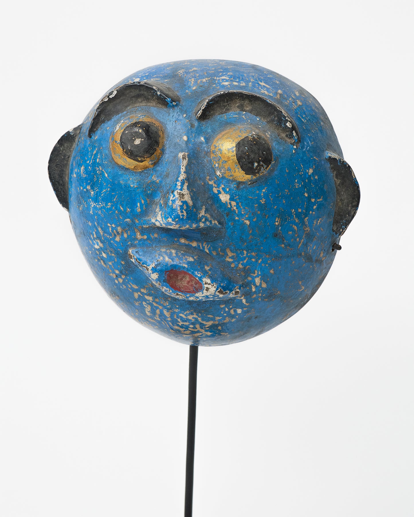 Abstract primitive mask on a stand