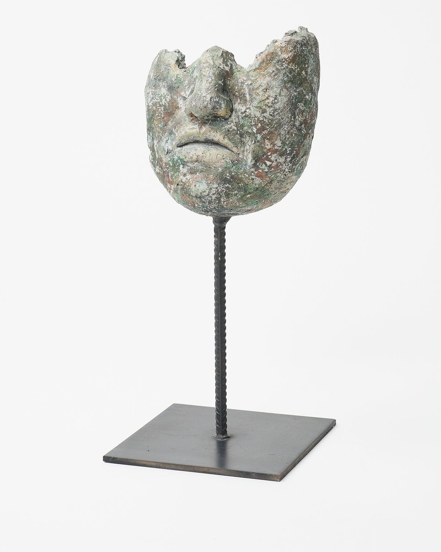 Face Sculpture on Base with Upper Third Omission